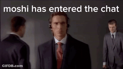 Man In Suit Wearing Headphones Talking On Phone GIF