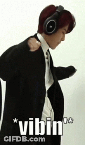 Man In Suit Wearing Headphones Vibin GIF
