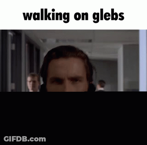 Man In Suit Wearing Headset GIF