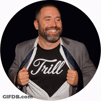 Man In Suit Wearing Trill Shirt GIF