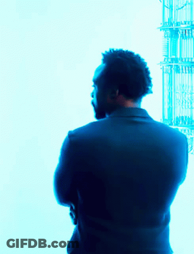 Man In Suit With Arms Crossed Blue Background GIF