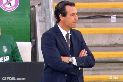 Man In Suit With Arms Crossed In Front Of Seat Blocked Sign GIF