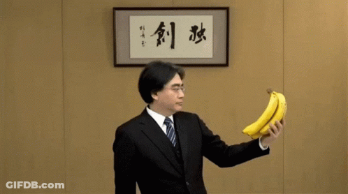 Man In Suit With Banana And Chinese Writing GIF