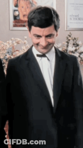 Man In Suit With Bow Tie Smiling GIF