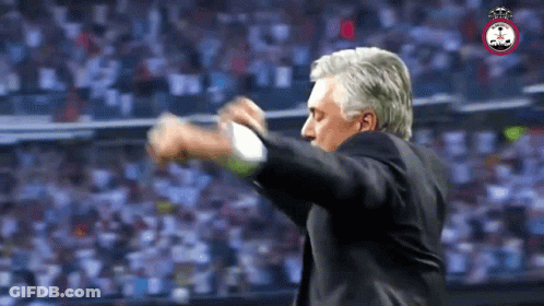 Man In Suit With Crowd And Soccer Logo GIF
