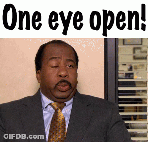 Man In Suit With Eyes Closed Saying One Eye Open GIF
