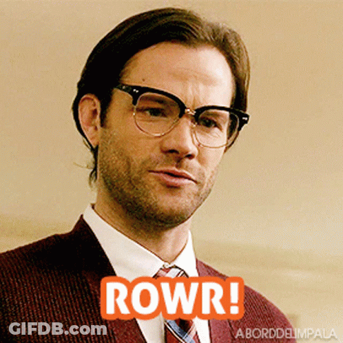 Man In Suit With Glasses Saying Rowr GIF