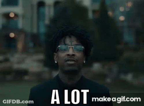 Man In Suit With Group At Mansion GIF