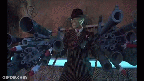 Man In Suit With Guns Saying Bang GIF