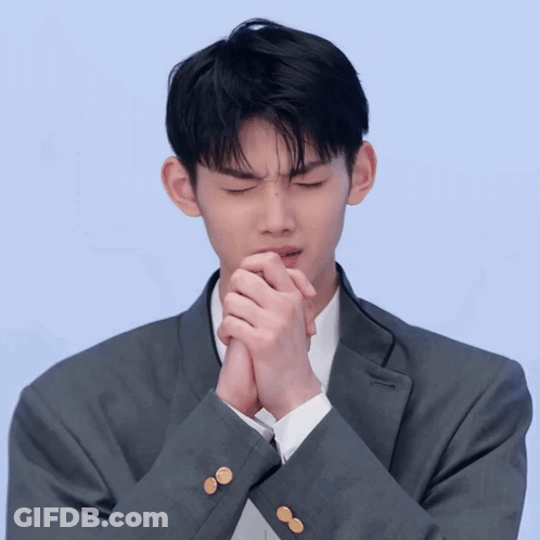 Man In Suit With Hands Folded GIF