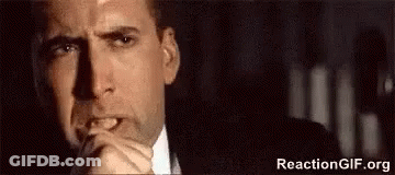 Man In Suit With Hands Folded GIF