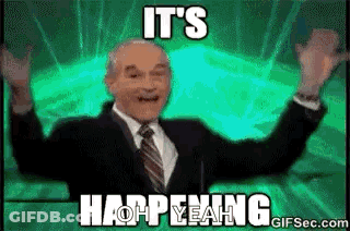 Man In Suit With Hands In Air GIF