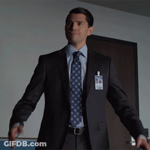 Man In Suit With James Name Tag GIF
