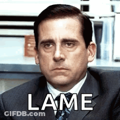 Man In Suit With Lame Written On Face GIF