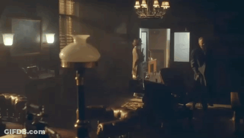 Man In Suit With Lamp And Lampshade GIF