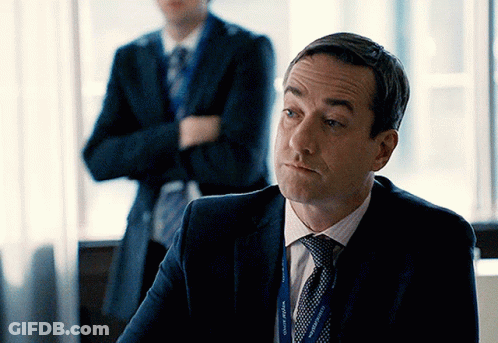 Man In Suit With Lanyard Saying County Affairs GIF