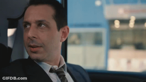 Man In Suit With Lanyard Saying County Affairs GIF
