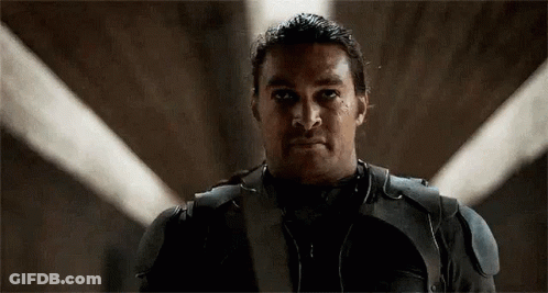 Man In Suit With Light Behind GIF