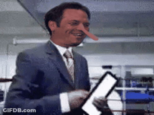 Man In Suit With Long Nose Smiling GIF