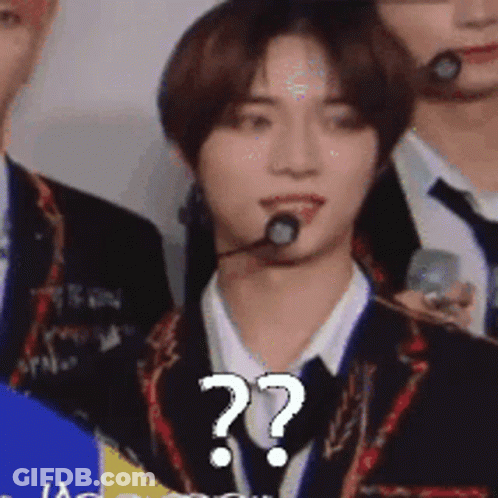 Man In Suit With Microphone And Question Mark GIF