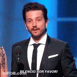 Man In Suit With Microphone Silencio Por Favor GIF
