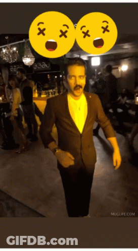 Man In Suit With Mustache In Front Of Two Smiley Faces Saying X And X GIF