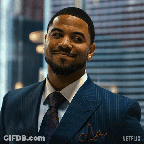 Man In Suit With Netflix Logo GIF