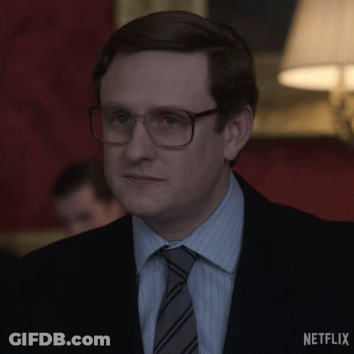 Man In Suit With Netflix Logo GIF