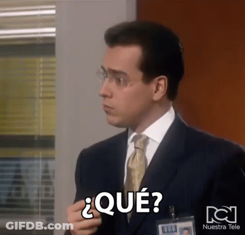 Man In Suit With Nuestra Tele Name Tag GIF