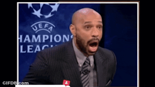 Man In Suit With Open Mouth Champions League Logo GIF