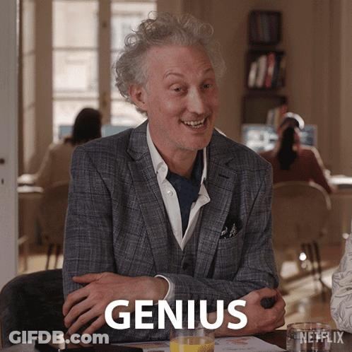 Man In Suit With Orange Juice Saying Genius GIF