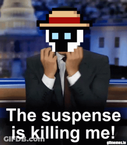 Man In Suit With Pixelated Skull Saying The Suspense Is Killing Me GIF
