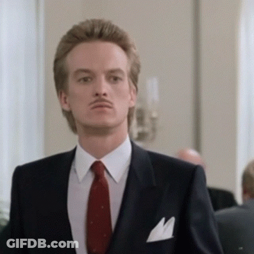 Man In Suit With Red Tie And Pocket Square GIF