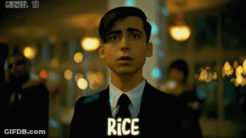 Man In Suit With Rice On Chest GIF