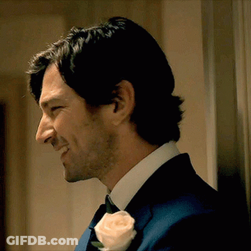 Man In Suit With Rose In Lapel GIF