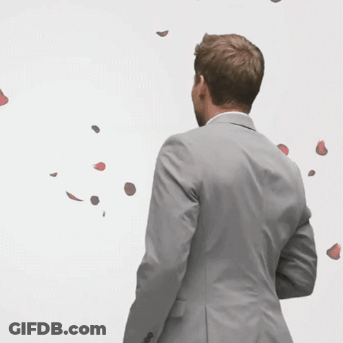 Man In Suit With Rose Petals GIF