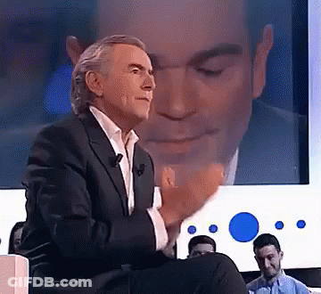 Man In Suit With Screen Reflection GIF