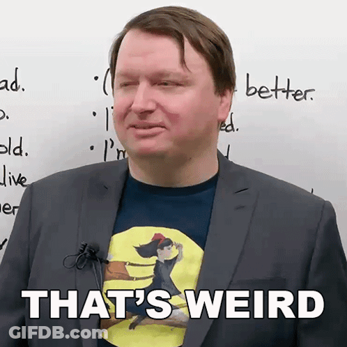 Man In Suit With Shirt Saying That's Weird GIF