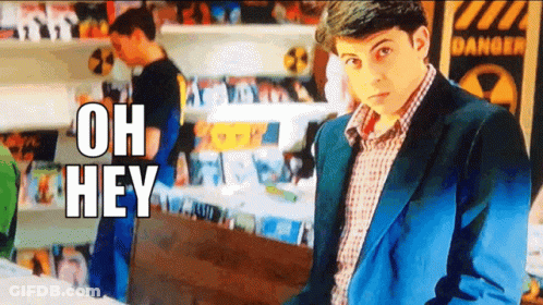 Man In Suit With Sign Saying Oh Hey GIF