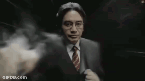 Man In Suit With Smoke Coming Out Of Mouth GIF