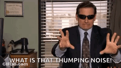 Man In Suit With Sunglasses Saying What Is That Thumping Noise GIF
