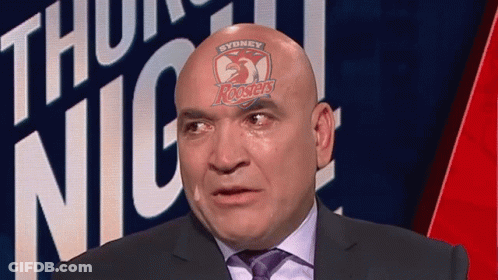 Man In Suit With Sydney Roosters Logo On Head GIF
