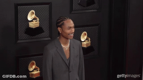 Man In Suit With Trophies GIF