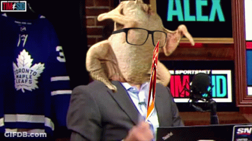 Man In Suit With Turkey On Head And Maple Leafs Jersey GIF