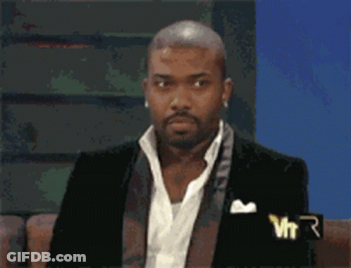 Man In Suit With VTR Logo On Couch GIF
