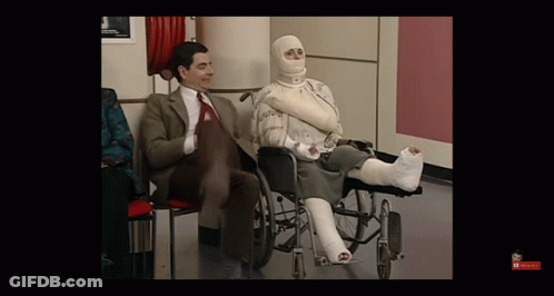 Man In Suit Woman In Wheelchair With Cast GIF