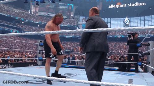 Man In Suit Wrestling Ring Allegiant Stadium Sign GIF