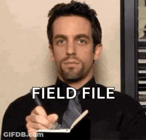 Man In Suit Writing In Notebook GIF