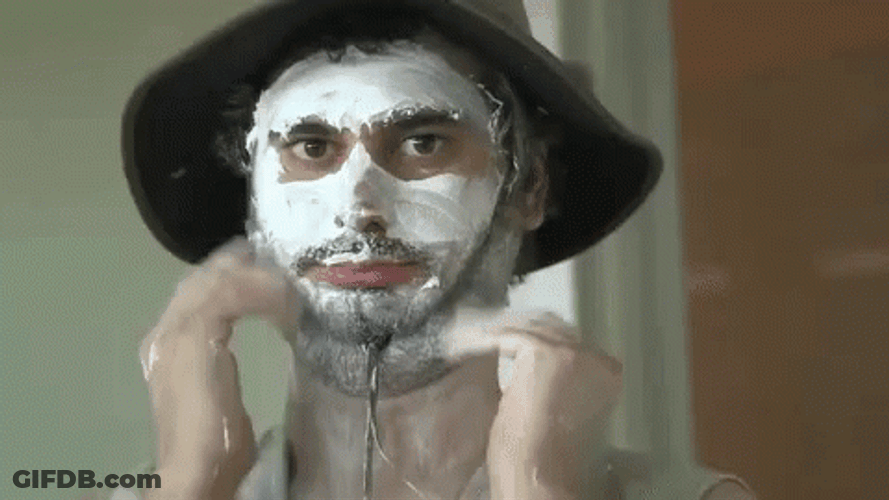Man In Sun Hat With Lotion In Face GIF