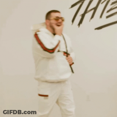 Man In Sunglasses And Backpack In Front Of Thieves Wall GIF